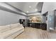 Finished basement with a seating area, bar with sink, and mini refrigerator at 1265 Emerald Se Ave, Atlanta, GA 30316