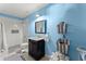 Bright bathroom with blue walls and a white-tiled shower at 1265 Emerald Se Ave, Atlanta, GA 30316