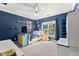 Bedroom featuring blue walls and a window offering an outside view at 1265 Emerald Se Ave, Atlanta, GA 30316