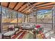 Inviting covered patio with comfortable seating, ceiling fan, and stylish rug for outdoor relaxation at 1265 Emerald Se Ave, Atlanta, GA 30316