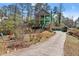 Exterior view of the home with a long driveway and green facade at 1265 Emerald Se Ave, Atlanta, GA 30316