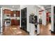 View of kitchen leading to living area; features stainless appliances, granite counters, and hardwood floors at 1265 Emerald Se Ave, Atlanta, GA 30316