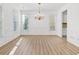 Bright and airy dining room with natural light and classic chandelier at 1536 Baxley Pine Trce, Suwanee, GA 30024