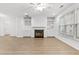Bright living room with built-in bookshelves and fireplace at 1536 Baxley Pine Trce, Suwanee, GA 30024