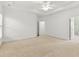 Spacious main bedroom features neutral carpeting and a trey ceiling at 1536 Baxley Pine Trce, Suwanee, GA 30024