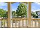 Beautiful porch view of the serene street, lush landscaping, and charming neighborhood at 1536 Baxley Pine Trce, Suwanee, GA 30024