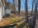 View of the backyard, utility shed and trees at 1580 Turner Rd, Cumming, GA 30041