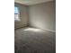 This bedroom features sunlit windows, plush carpeting, and neutral walls at 1580 Turner Rd, Cumming, GA 30041
