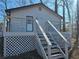 Charming home featuring stairs, deck and horizontal metal railing at 1580 Turner Rd, Cumming, GA 30041