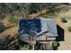 Aerial view of house showcasing backyard deck, manicured landscaping, and new roof at 1630 Versailles Dr, Atlanta, GA 30331