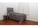 Cozy bedroom with hardwood floors and a twin bed next to a bright window at 1630 Versailles Dr, Atlanta, GA 30331