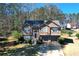 Charming two-story home with well-maintained lawn, mature trees, and a two-car garage at 1630 Versailles Dr, Atlanta, GA 30331