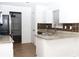 Bright kitchen features granite countertops, white cabinets, and stainless steel appliances at 1630 Versailles Dr, Atlanta, GA 30331