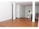 Bright living room features hardwood floors, white walls, columns, and ample light at 1630 Versailles Dr, Atlanta, GA 30331