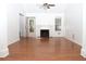 Bright living room features hardwood floors, fireplace, ceiling fan, and ample natural light at 1630 Versailles Dr, Atlanta, GA 30331