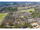An aerial view showcasing a neighborhood, greenery, and a winding road through a scenic, wooded area at 279 Laura Cir, Bowdon, GA 30108