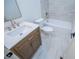 Bathroom featuring a vanity, commode, and tub with tiled walls at 279 Laura Cir, Bowdon, GA 30108