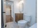 Bathroom with a wooden vanity and a view through an open door at 279 Laura Cir, Bowdon, GA 30108