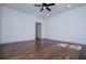 Bright bedroom featuring hardwood floors, modern ceiling fan, and neutral paint, creating a serene and inviting atmosphere at 279 Laura Cir, Bowdon, GA 30108