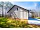 Exterior of home with back porch overlooking lawn and woods at 279 Laura Cir, Bowdon, GA 30108