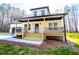 Charming home featuring a welcoming front porch with wooden steps and a beautifully landscaped yard at 279 Laura Cir, Bowdon, GA 30108