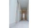 Well-lit hallway with neutral walls and carpet, leading to multiple rooms in the home at 279 Laura Cir, Bowdon, GA 30108