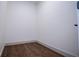 Empty laundry room with hardwood floors, neutral paint, ready for customization at 279 Laura Cir, Bowdon, GA 30108