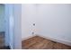 Laundry room with hardwood floors, neutral paint, and hookups ready for appliances at 279 Laura Cir, Bowdon, GA 30108
