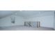 Bright loft area featuring a window and modern railing, creating an open and inviting space at 279 Laura Cir, Bowdon, GA 30108