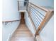 Elegant wooden staircase features modern railing design, enhancing the home's contemporary aesthetic at 279 Laura Cir, Bowdon, GA 30108
