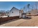 Spacious backyard features a wooden fence, lush landscaping, and a charming covered patio, perfect for outdoor entertaining at 5242 Park Vale Dr, Sugar Hill, GA 30518