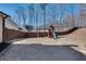 This private backyard showcases a swing set and slide set, ideal for and outdoor enjoyment at 5242 Park Vale Dr, Sugar Hill, GA 30518