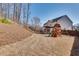 Expansive backyard with a covered patio, play set, and lush landscaping, perfect for outdoor activities and relaxation at 5242 Park Vale Dr, Sugar Hill, GA 30518