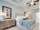 Spacious main bedroom featuring a neutral color palette, trey ceilings, and natural light at 5242 Park Vale Dr, Sugar Hill, GA 30518
