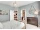Stylish bedroom with textured blue walls, pendant lighting and light neutral carpet at 5242 Park Vale Dr, Sugar Hill, GA 30518