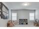 Spacious playroom with plenty of space and natural light from the two bright windows at 5242 Park Vale Dr, Sugar Hill, GA 30518