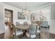 Cozy dining room featuring a round table, stylish chairs, and elegant light fixtures at 5242 Park Vale Dr, Sugar Hill, GA 30518