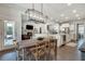 Inviting dining room with rustic table and chairs seamlessly connected to the open-concept living area at 5242 Park Vale Dr, Sugar Hill, GA 30518