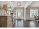Elegant entryway featuring hardwood floors, stylish furnishings, and abundant natural light at 5242 Park Vale Dr, Sugar Hill, GA 30518