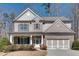 Beautiful two-story home with brick and siding, well-maintained landscaping, and attached garage at 5242 Park Vale Dr, Sugar Hill, GA 30518