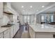 Bright kitchen with white cabinets, granite countertops, and stainless steel appliances at 5242 Park Vale Dr, Sugar Hill, GA 30518