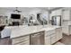 Bright kitchen with granite countertops, stainless steel appliances, and an open view to the living area at 5242 Park Vale Dr, Sugar Hill, GA 30518