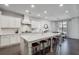 Spacious kitchen with a large island, white cabinetry, and stainless steel appliances at 5242 Park Vale Dr, Sugar Hill, GA 30518