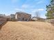Large backyard with privacy fence, patio and chairs at 520 Ballyshannon Dr, Dacula, GA 30019