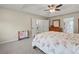 Bright bedroom with carpet flooring, ceiling fan, and access to other rooms at 520 Ballyshannon Dr, Dacula, GA 30019