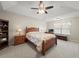 Spacious bedroom features a ceiling fan, tray ceiling, and a cozy atmosphere for relaxation at 520 Ballyshannon Dr, Dacula, GA 30019