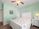 Charming bedroom with wood floors, ceiling fan, and white bedroom suite at 520 Ballyshannon Dr, Dacula, GA 30019