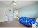 Cozy bedroom with a ceiling fan, carpet flooring, and easy access to the hallway at 520 Ballyshannon Dr, Dacula, GA 30019