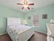 Bedroom featuring plush carpeting, ceiling fan, and white bedroom suite at 520 Ballyshannon Dr, Dacula, GA 30019
