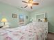 Bedroom with carpeting, fan, and white furniture including dressers, mirror, and nightstand at 520 Ballyshannon Dr, Dacula, GA 30019